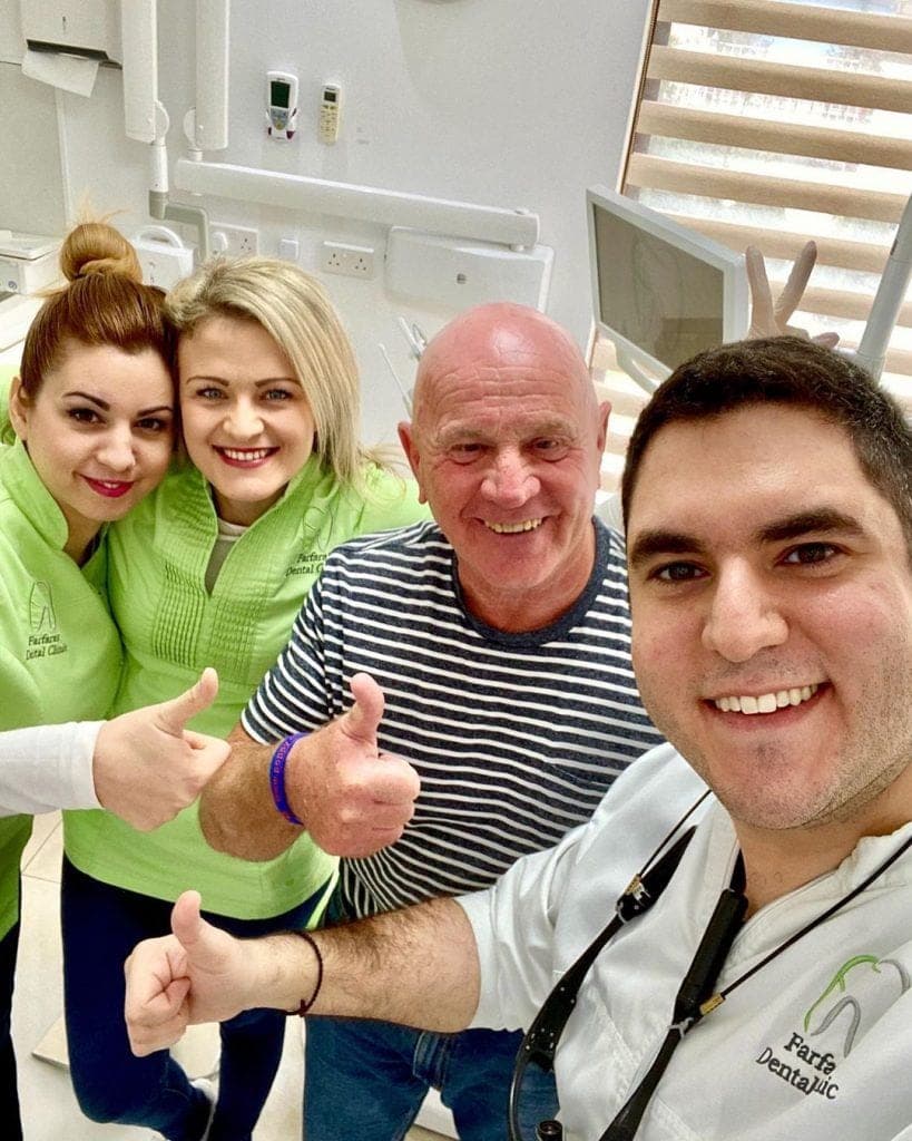 Happy patient smiling after dental treatment at Farfaras Dental Clinic
